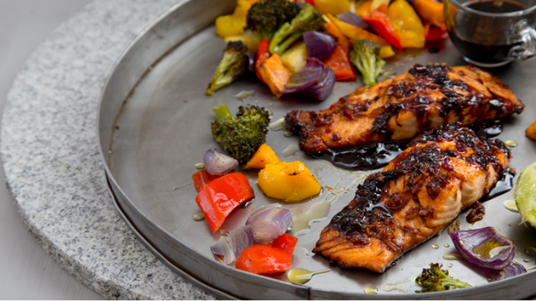 “Oven-roasted salmon with lemon and vegetables — a high-protein, low-calorie meal.”
