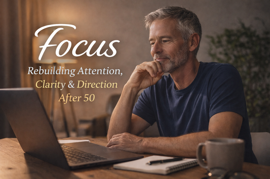 “Midlife man working calmly at a desk, rebuilding focus, clarity and direction after 50”