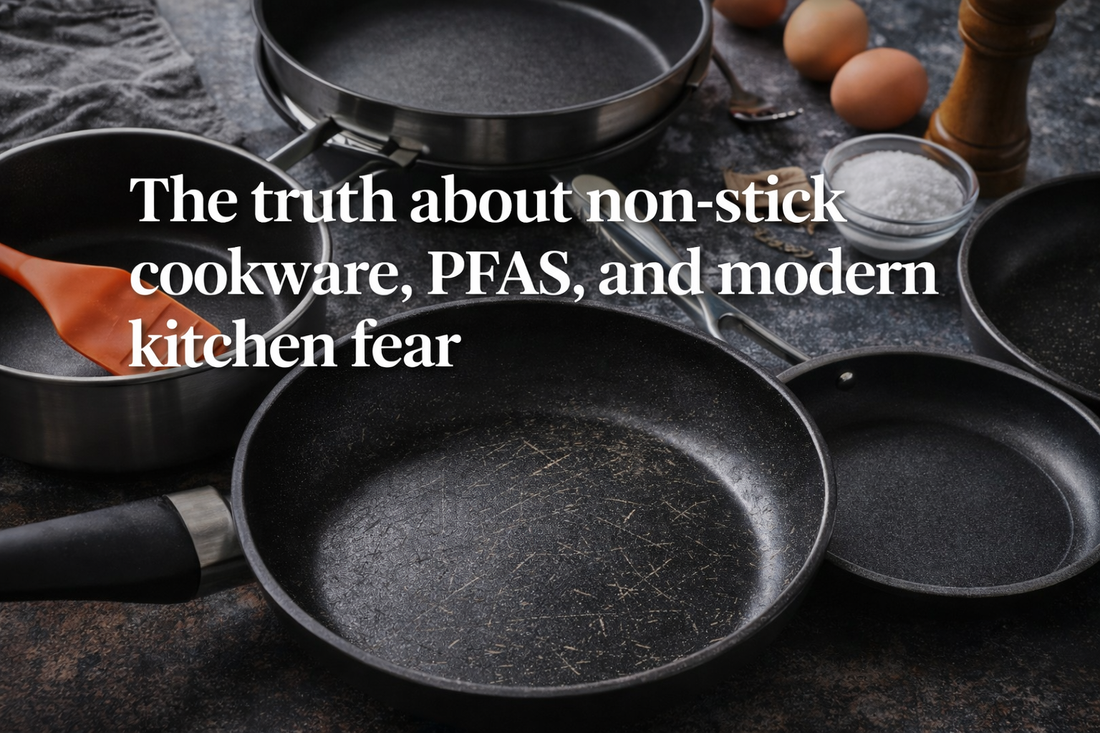 Non-stick frying pans arranged on a kitchen counter, representing debates around PFAS and cookware safety.